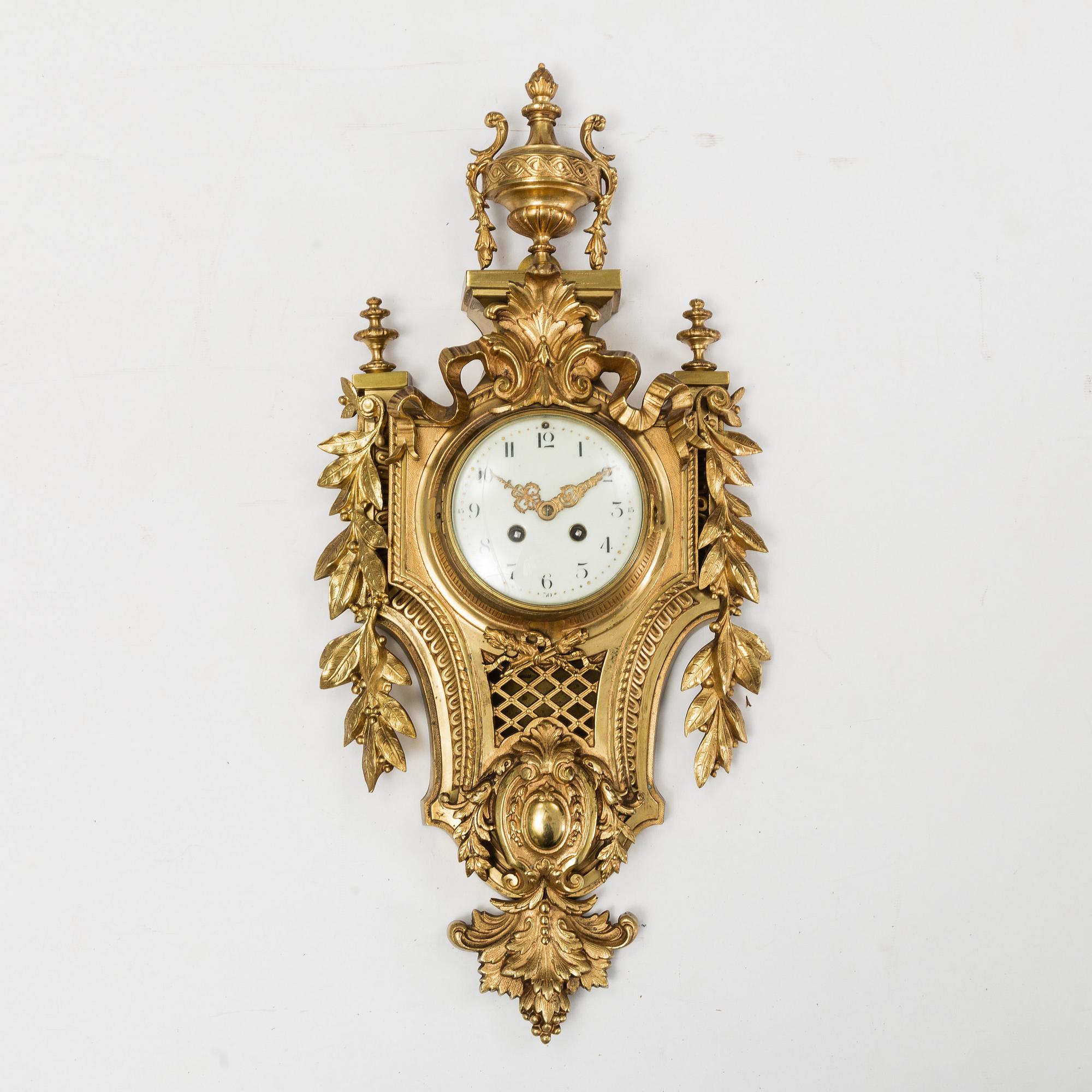 A first half of the 20th century brass wall clock.