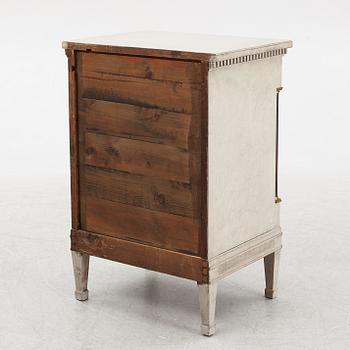 A chest of drawers, circa 1900.