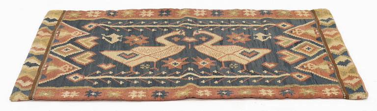 A carriage cushion, flat weave, c 87 x 58 cm, Skåne, circa 1900.