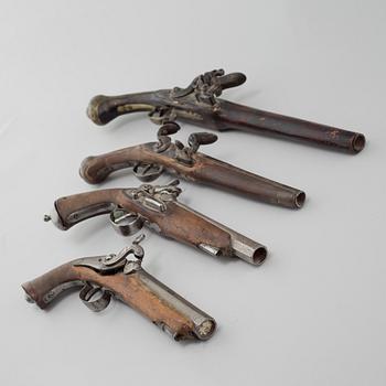 Four percussion and flintlock revolvers from the late 18th century / 19th century.