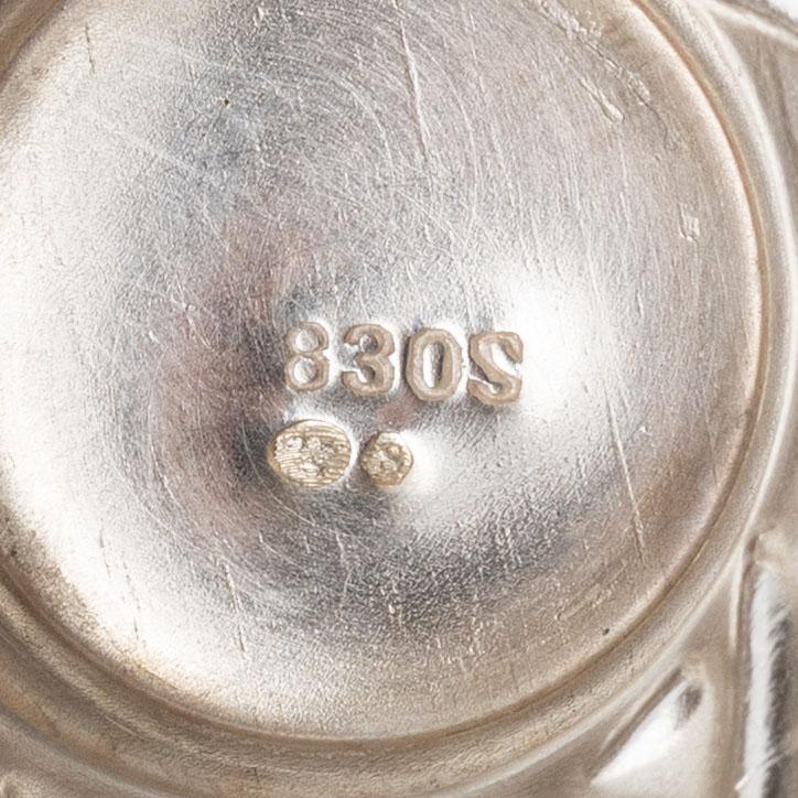 A set of three silver Rococo style shakers, 20th Century.