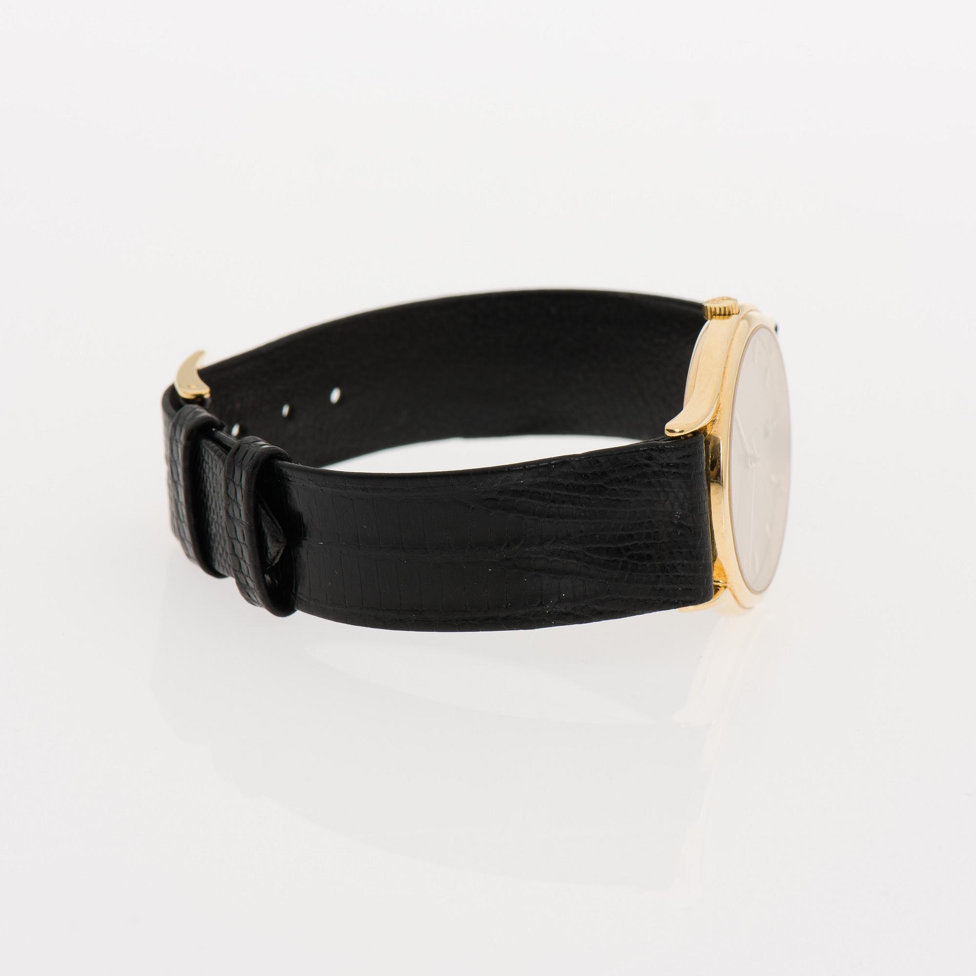 ARMBANDSUR, herr, Corum, 18K guld, original läderarmband. Garanti intyg 2007.