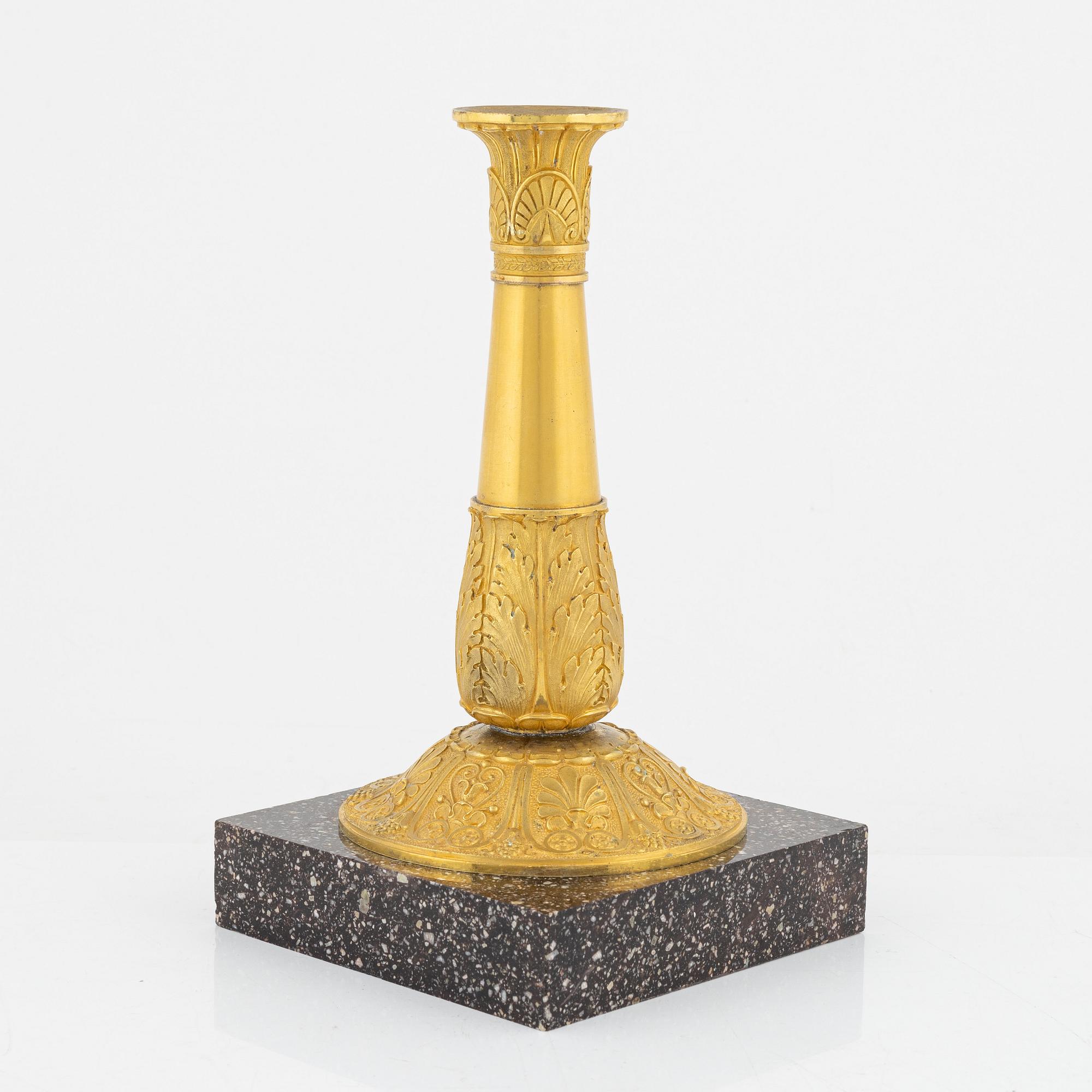 A bronze and porphyry candlestick, 20th Century.