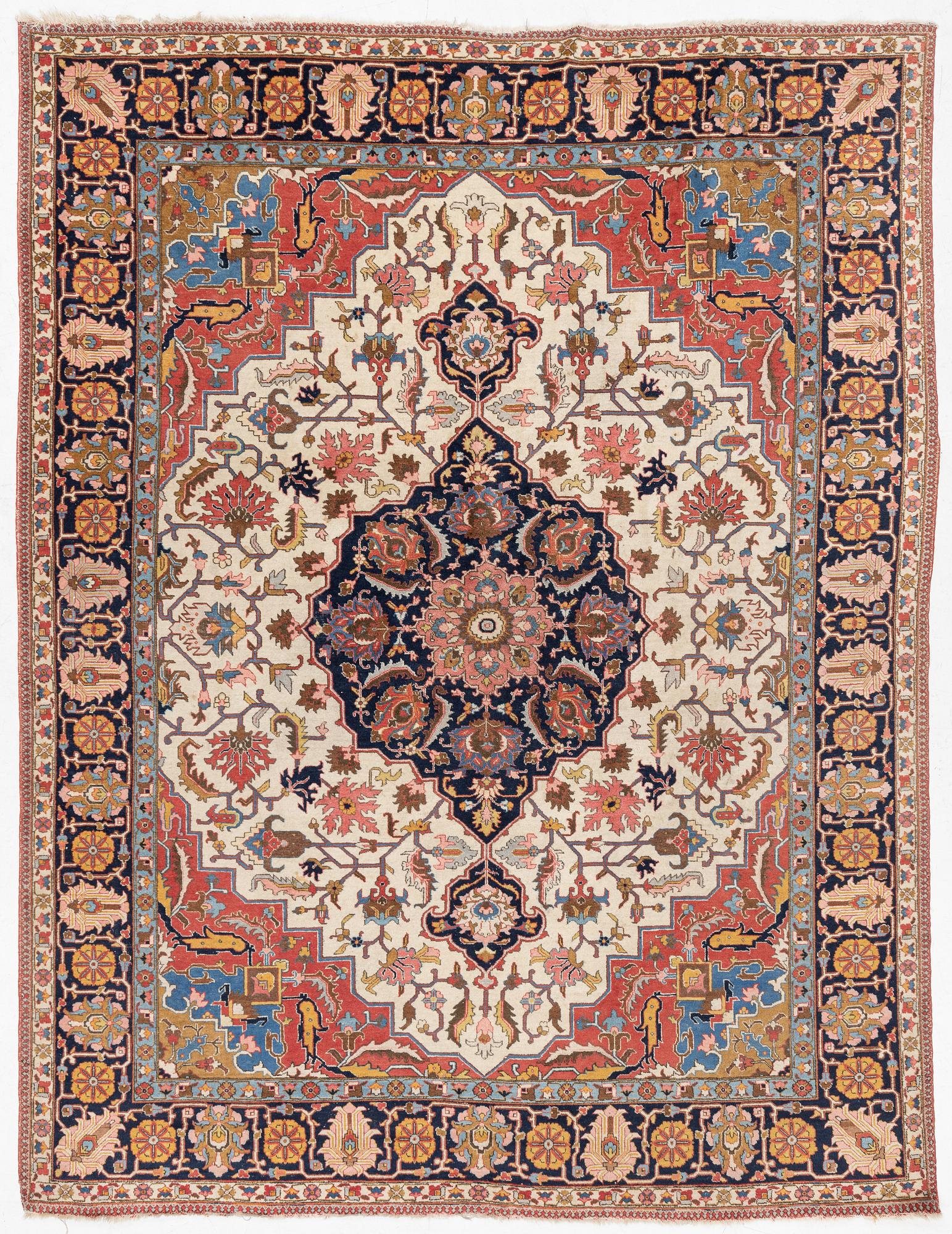 An antique Tabriz carpet, c. 365 x 280 cm.