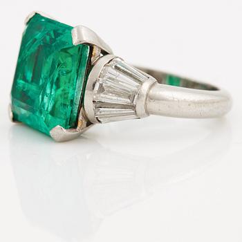 A columbian emerald and tapered cut diamond ring.
