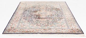 An oriental carpet, mercerized cotton, c. 275 x 182 cm.