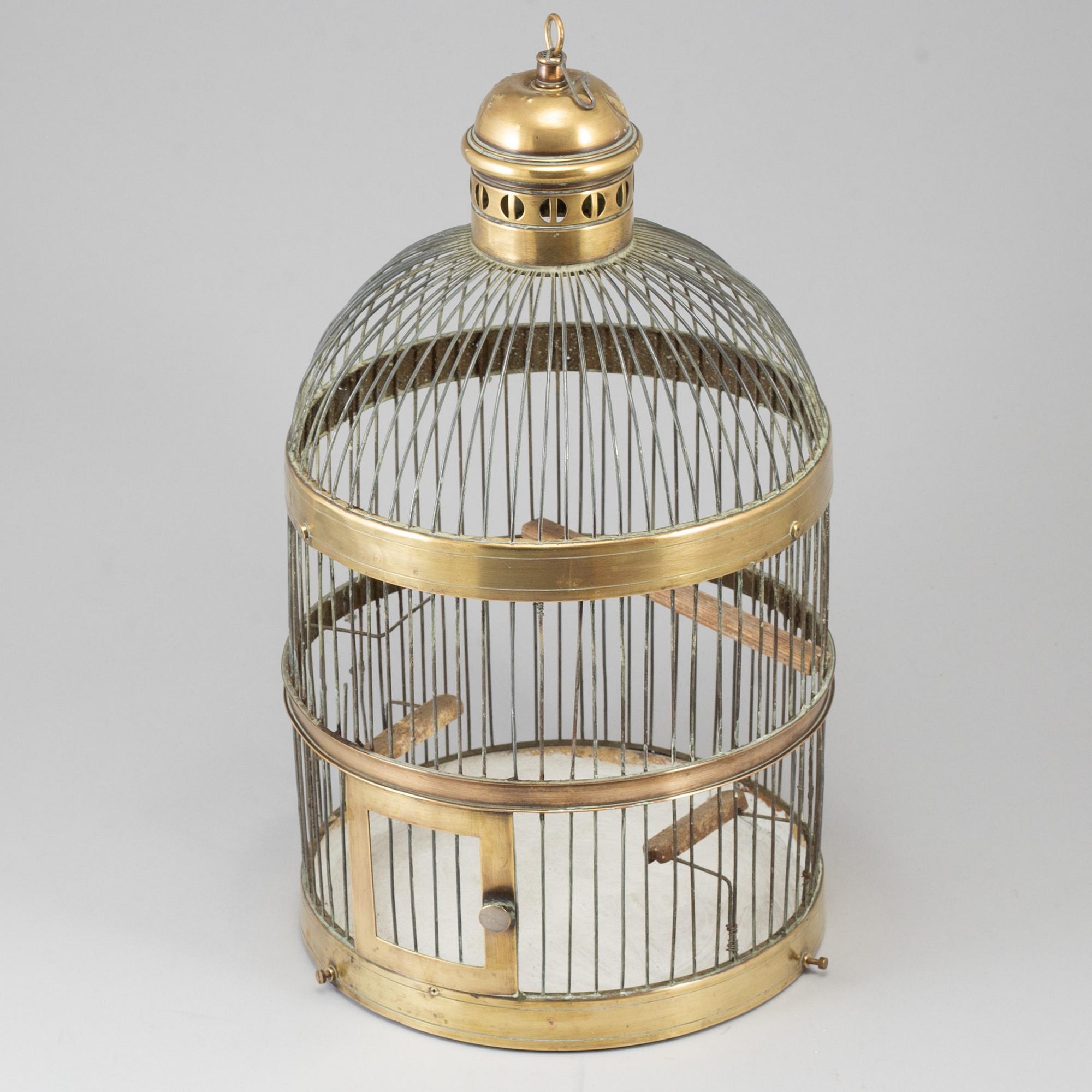 A 19th century brass bird cage.