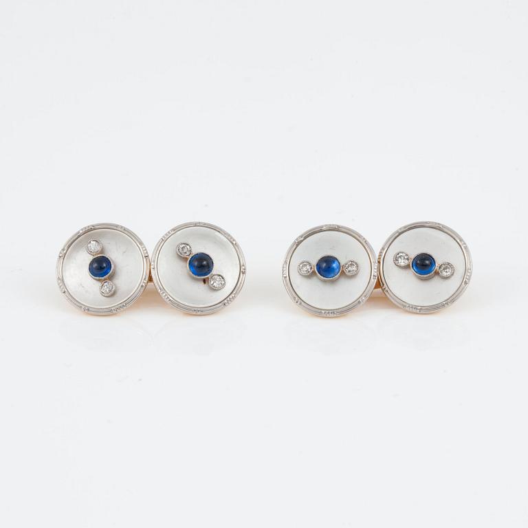 A pair of mother of pearl, diamond and cabochon-cut sapphire cufflinks. Circa 1920.
