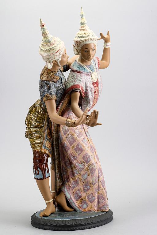 A Lladro stone ware figurine.