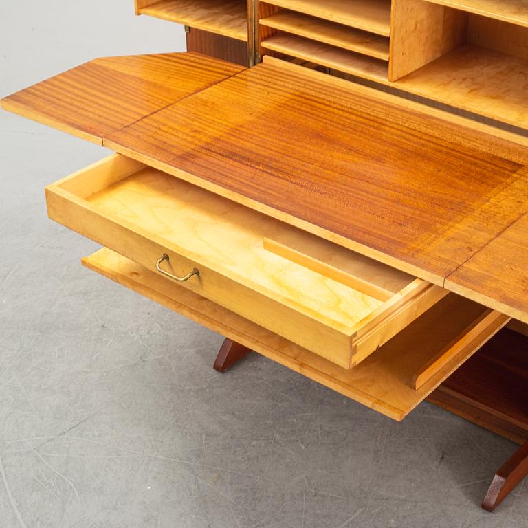 A mahogany veneered convertible cabinet, mid 20th Century.