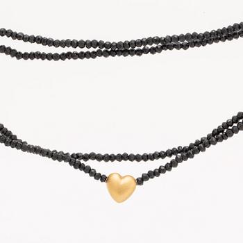 Ole Lynggaard, necklace faceted onyxbeads and clasp 18K gold, dustbag and original case.