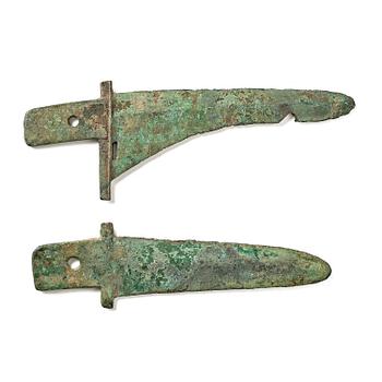 1078. Two archaic bronze daggers,  Shou or Han dynasty.