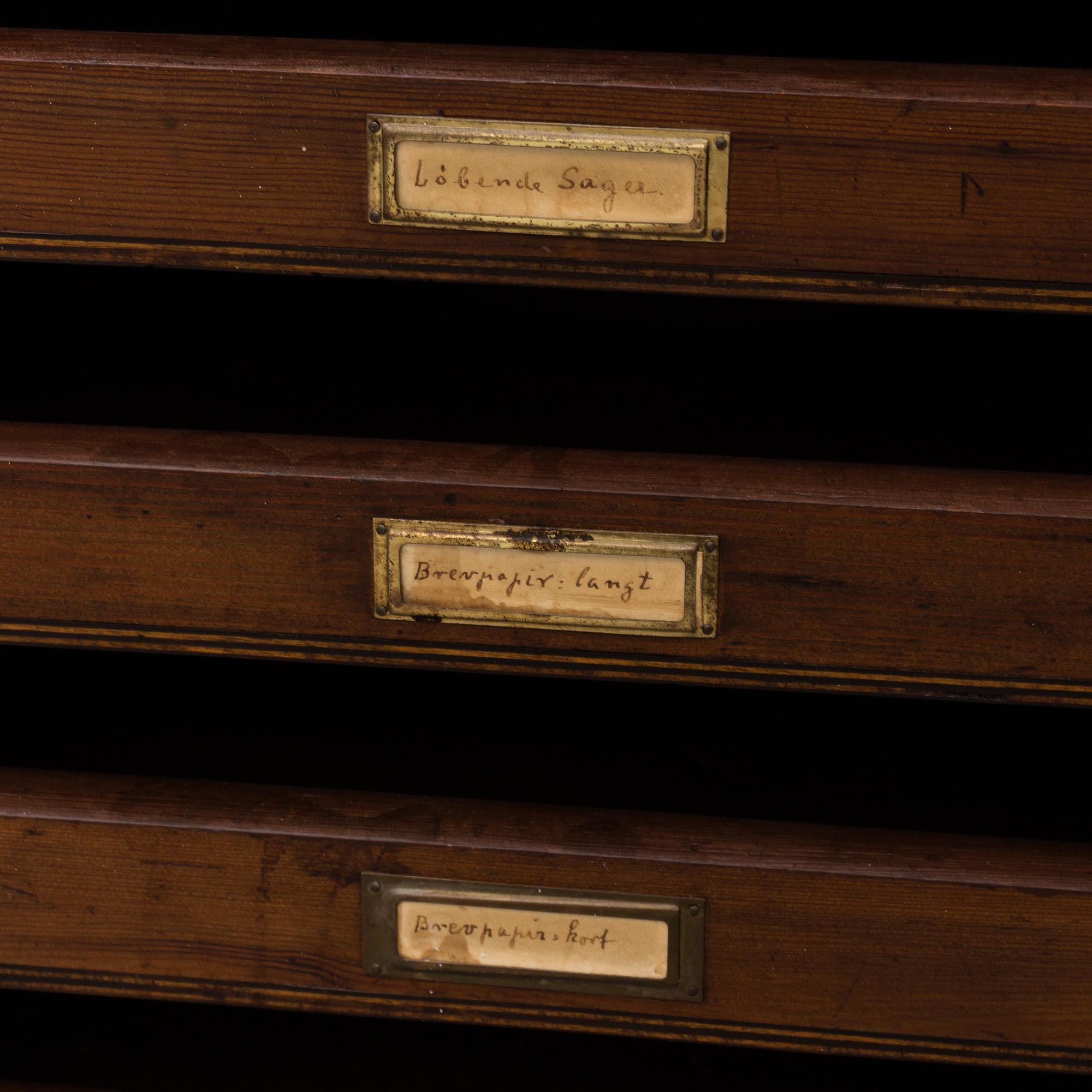 An early 20th Century stained pine office furniture.