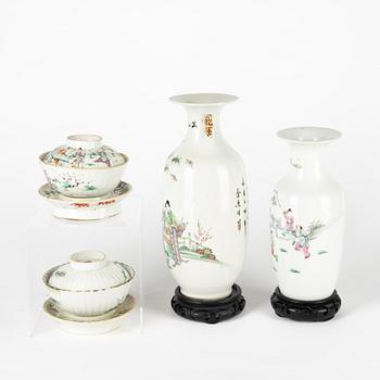 A set of two Chinese famille rose vases and two cups with covers and stands, late Qing dynasty/early 20th Century.