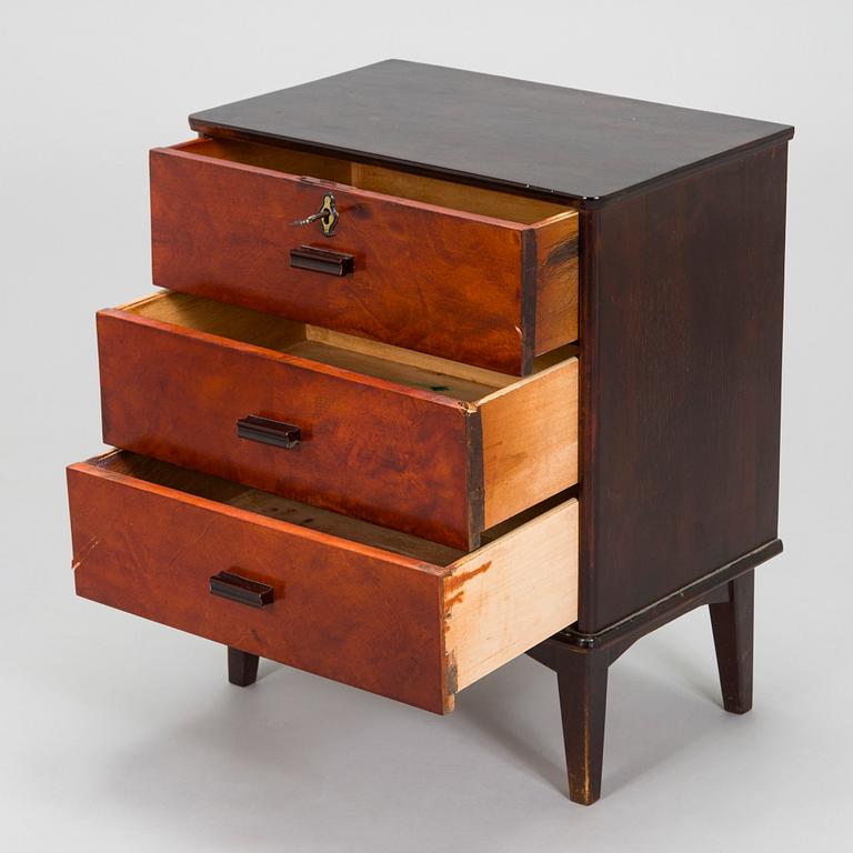 A 1930s functionalist style chest of drawer.