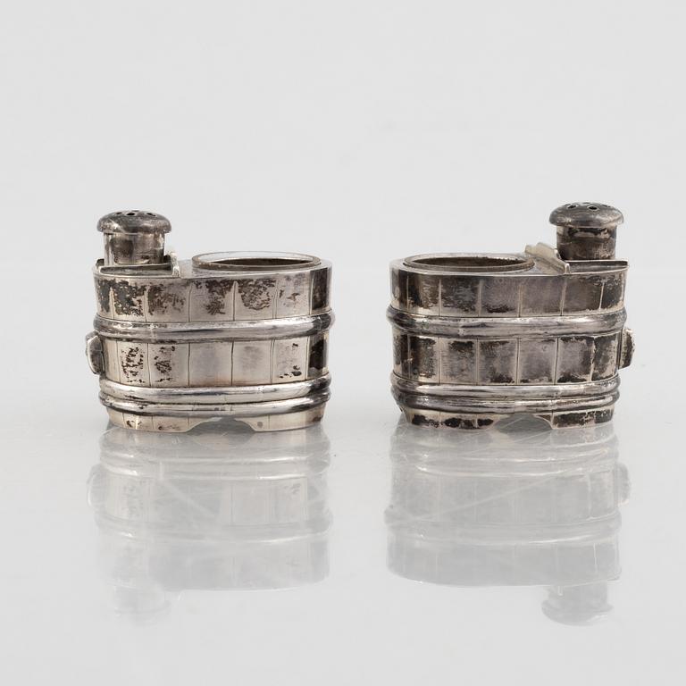 A set of three Japanese silver coasters and a pair of salts with shakers, 20th century.