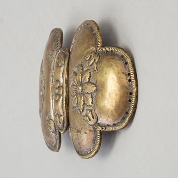 An 18th century brass buckle.