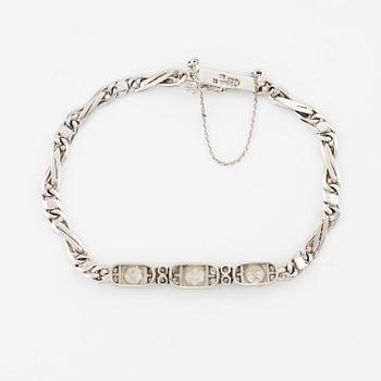 An 18K white gold bracelet set with old-and eight-cut diamonds.
