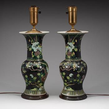 A pair of famille noir vases mounted as lamps, Qing dynasty, 19th Century.