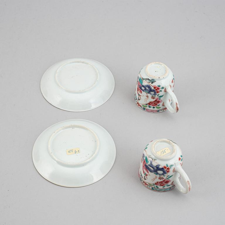 A pair of famille rose cups with dishes, Qing dynasty, Yongzheng (1723-35).