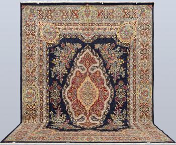 A semi-antique Kirman Laver carpet, 'Millefleur', signed, approx. 427 x 309 cm.