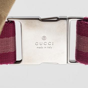 Gucci, a canvas beltbag.