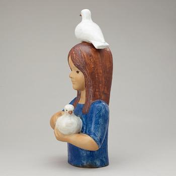 A Lisa Larson Larson stoneware sculpture of a girl with doves, Gustavsberg.