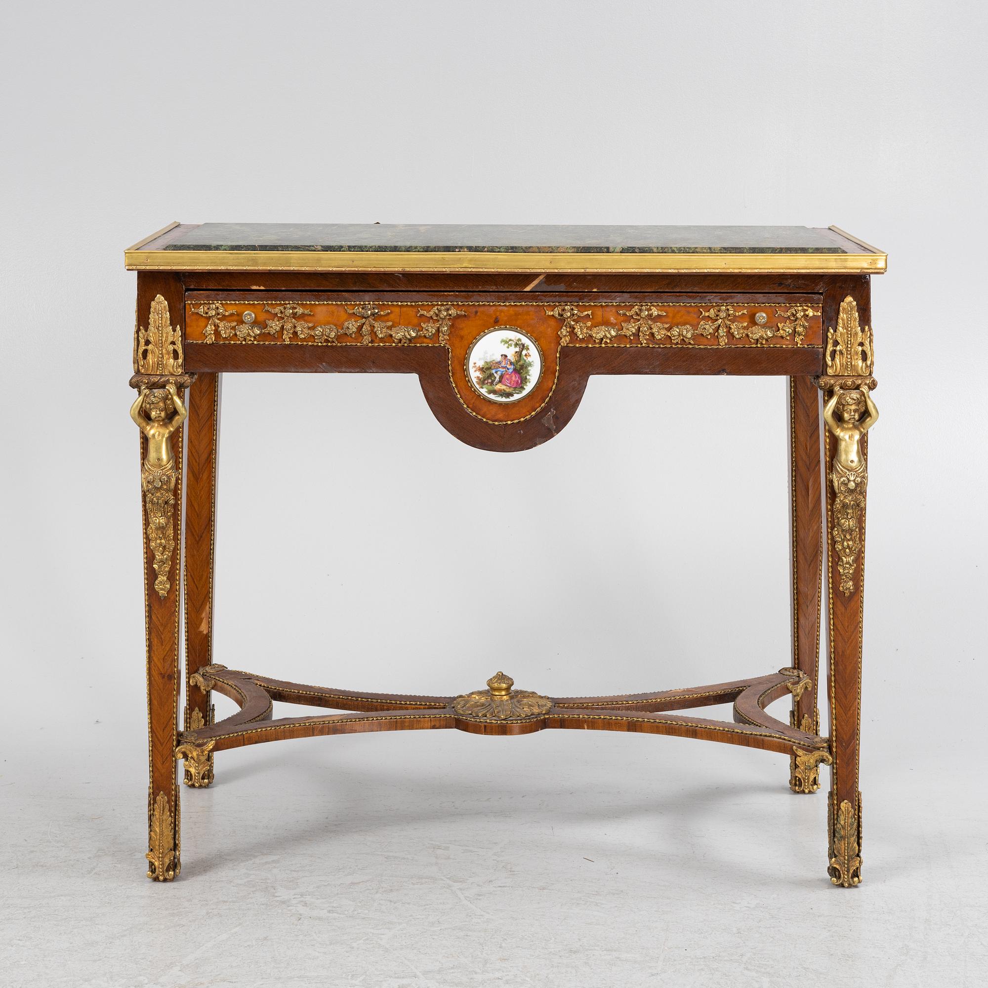 A Louis XVI-style gilt-brass mounted console table, circa 1900.