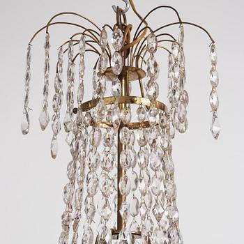 A late Gustavian nine-light gilt brass and cut glass chandelier, Stockholm, late 18th century.