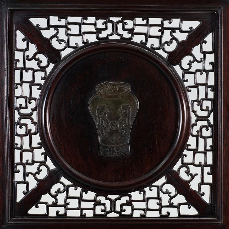A four panel screen with porcelain placques, Qing dynasty, 19th Century.