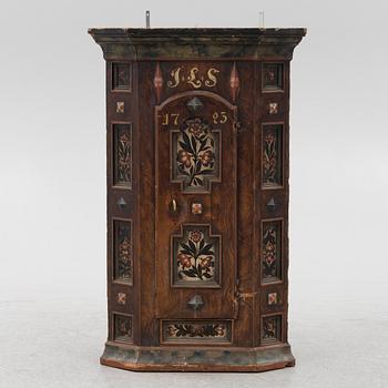 A Swedish painted corner cupboard, 18th Century.