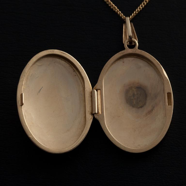 MEDALJONG/HÄNGE, 14K guld, akvamarin, 4 små diamanter. Vikt 5,8 g.