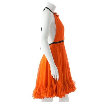 DOLCE & GABBANA, an orange silk cocktail dress.