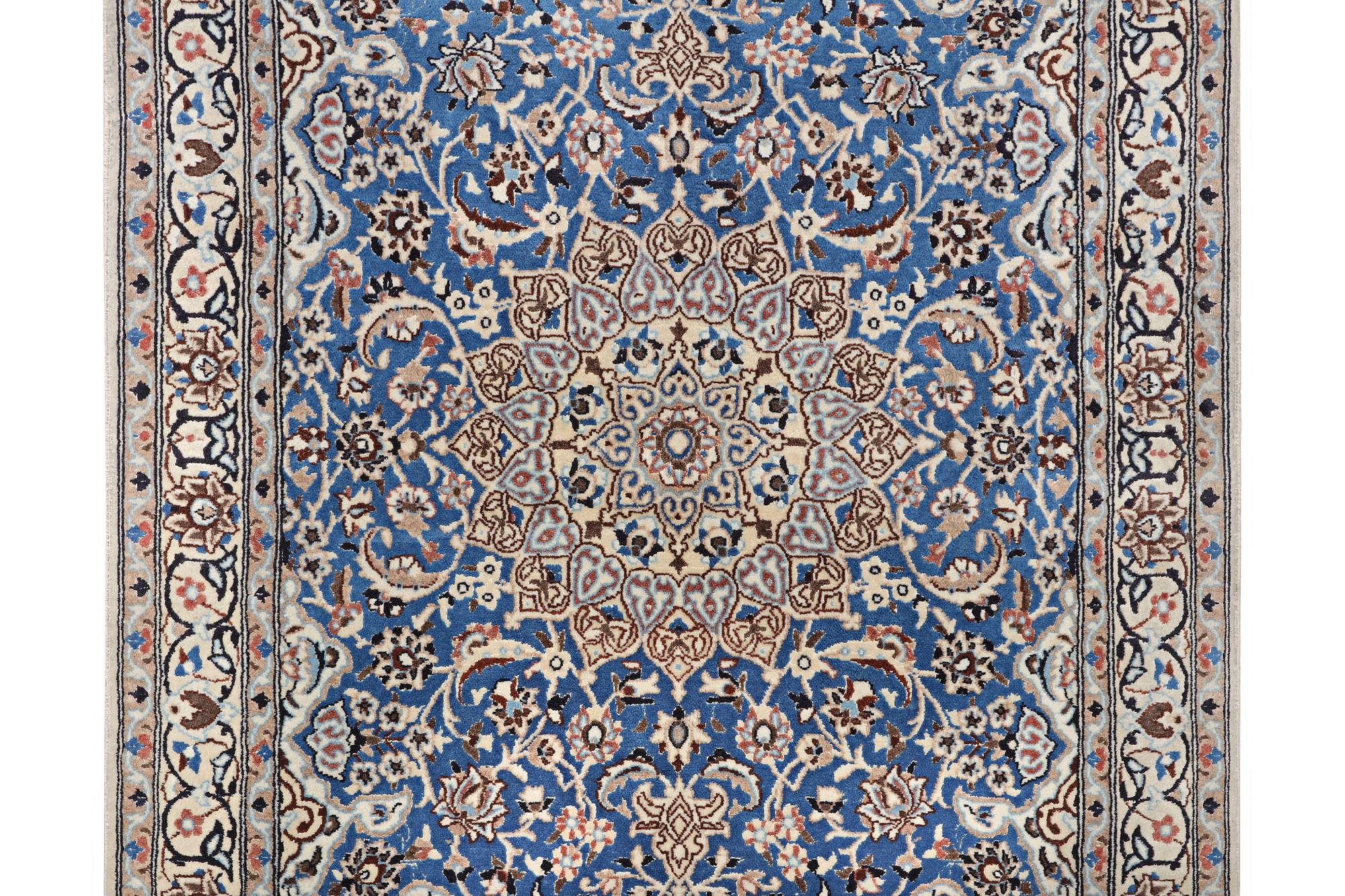 A Nain rug, part silk, 9 laa, c. 190 x 118 cm.