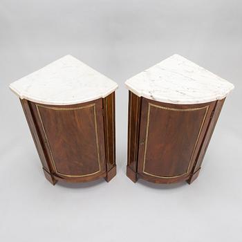 A pair of French Directoire corner cabinets from late 18th century.