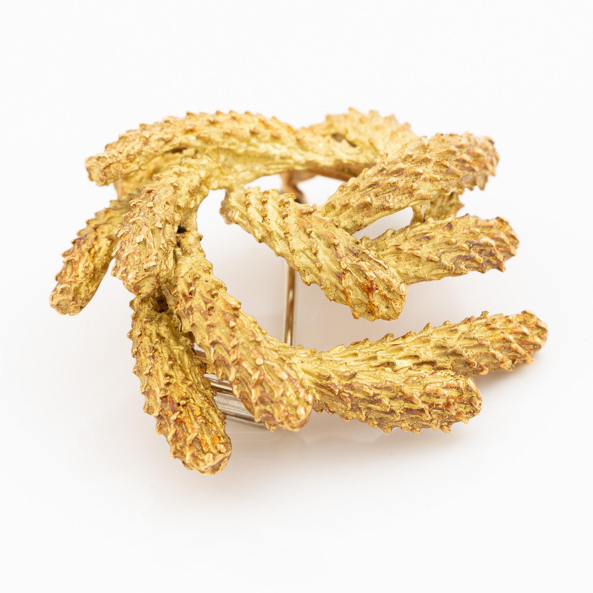 Brosch Hermès 18K guld i form av krans.