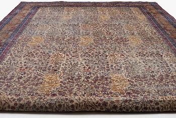 An antique 'Millefleur' Kerman Laver carpet, c. 964 x 426 cm.