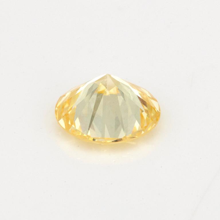 A 0.98ct fancy light yellow/VVS diamond.