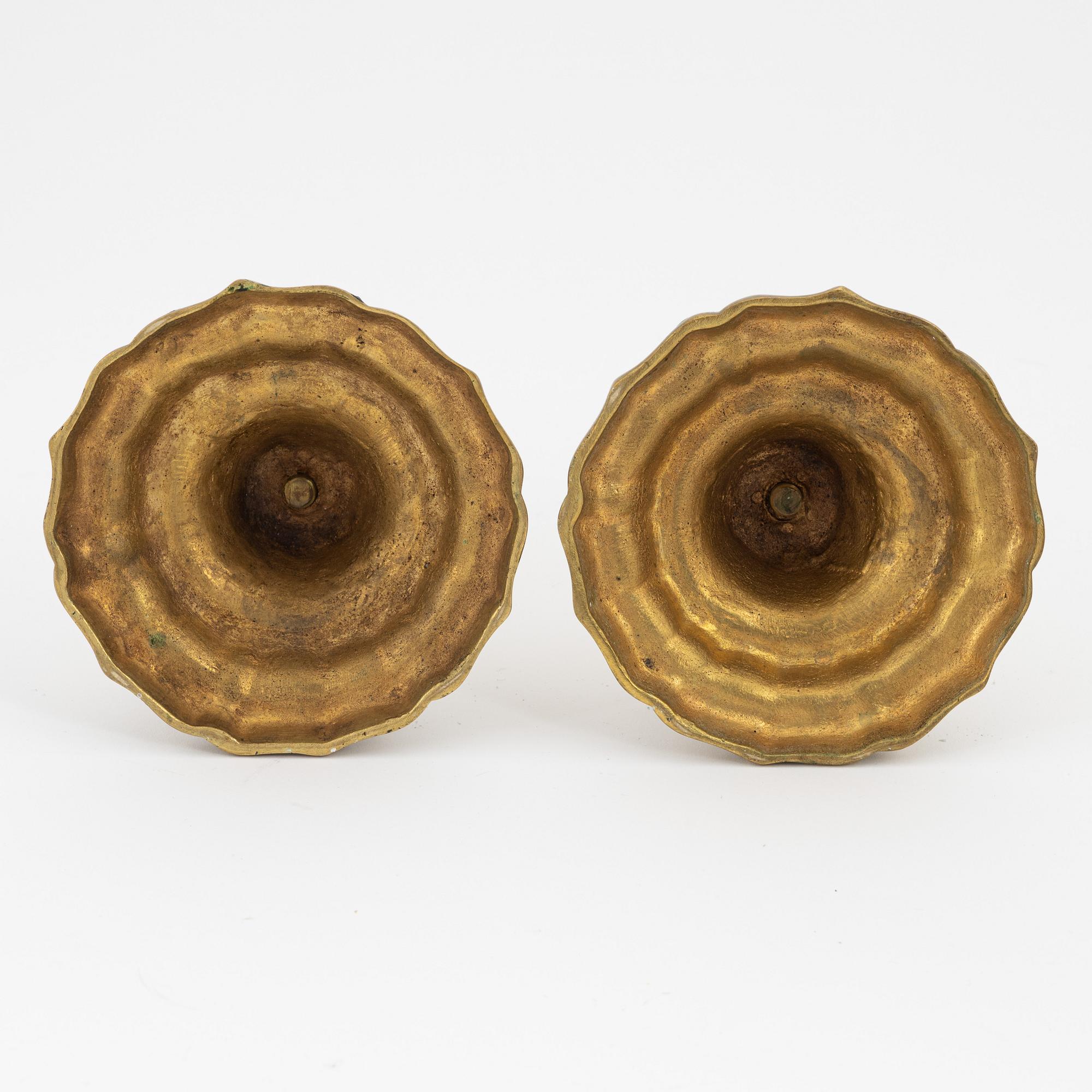 A pair of French brass candles sticks, 19th Century.
