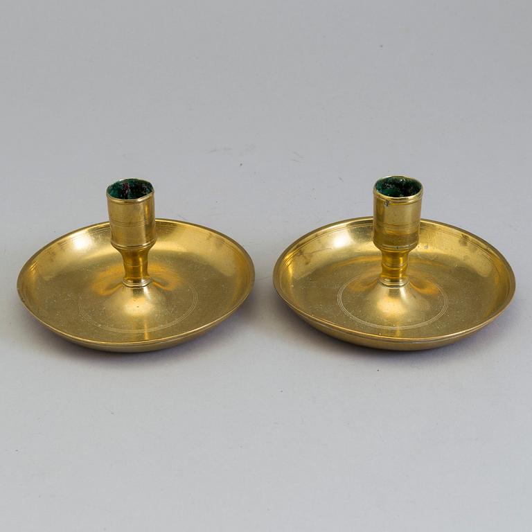 A pair of Swedish 18th century travelling brass candlesticks.