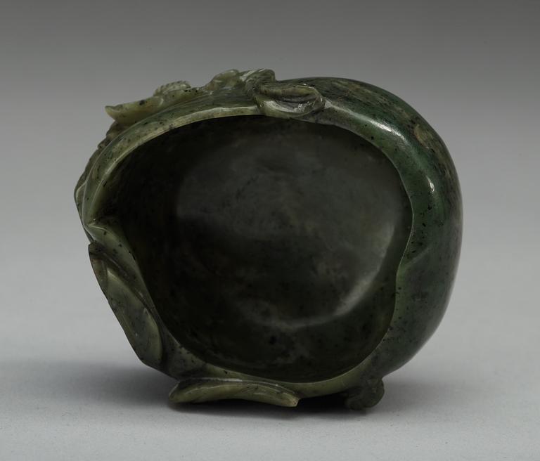 A carved nephrite brush washer, Qing dynasty.