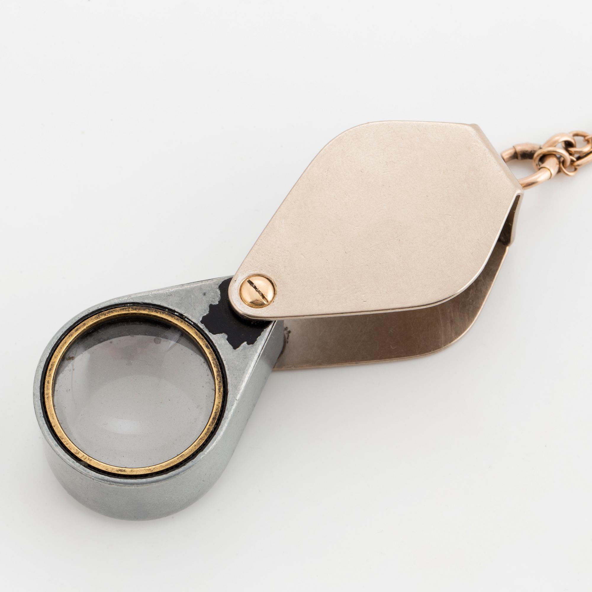 LOUPE, setting 18K white gold with 50X in diamonds, chain gold.