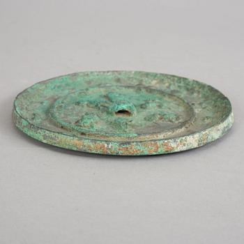 A broze mirror, presumably Tang dynasty (618-907 A.D.).