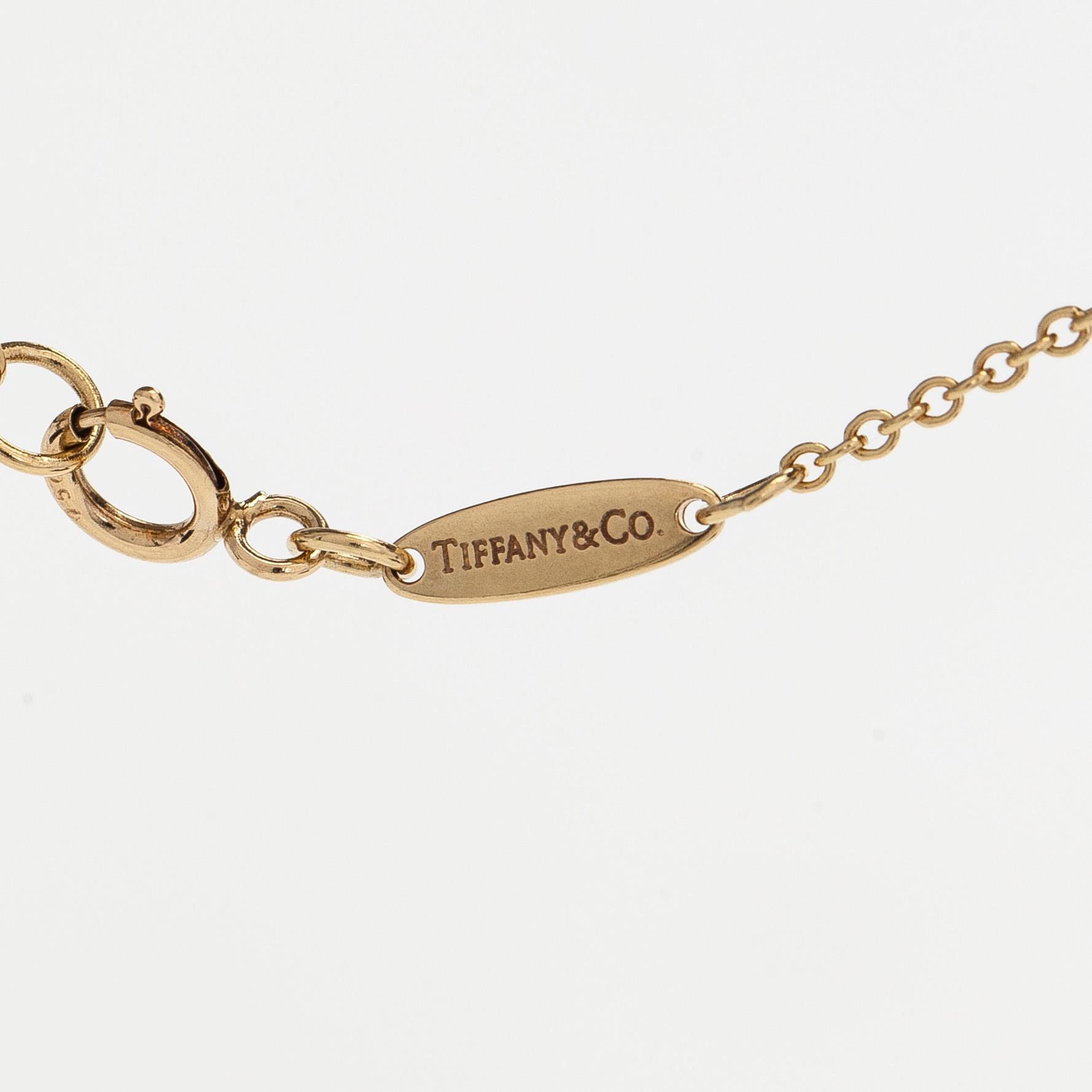 Tiffany & Co, Elsa Peretti, an 18K gold "Open Heart" necklace.