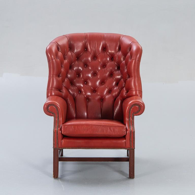 An English leather wing back chair later part of the 20th century.