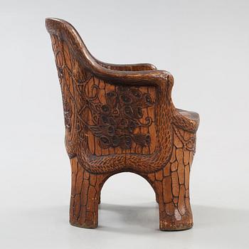A Gustaf Fjaestad Art Nouveau carved pine chair 'Stabbestol', by Adolf Swanson, Arvika, Sweden 1908.