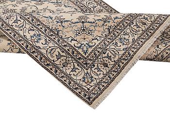 A rug, Nain, part silk, ca. 237 x 167 cm.