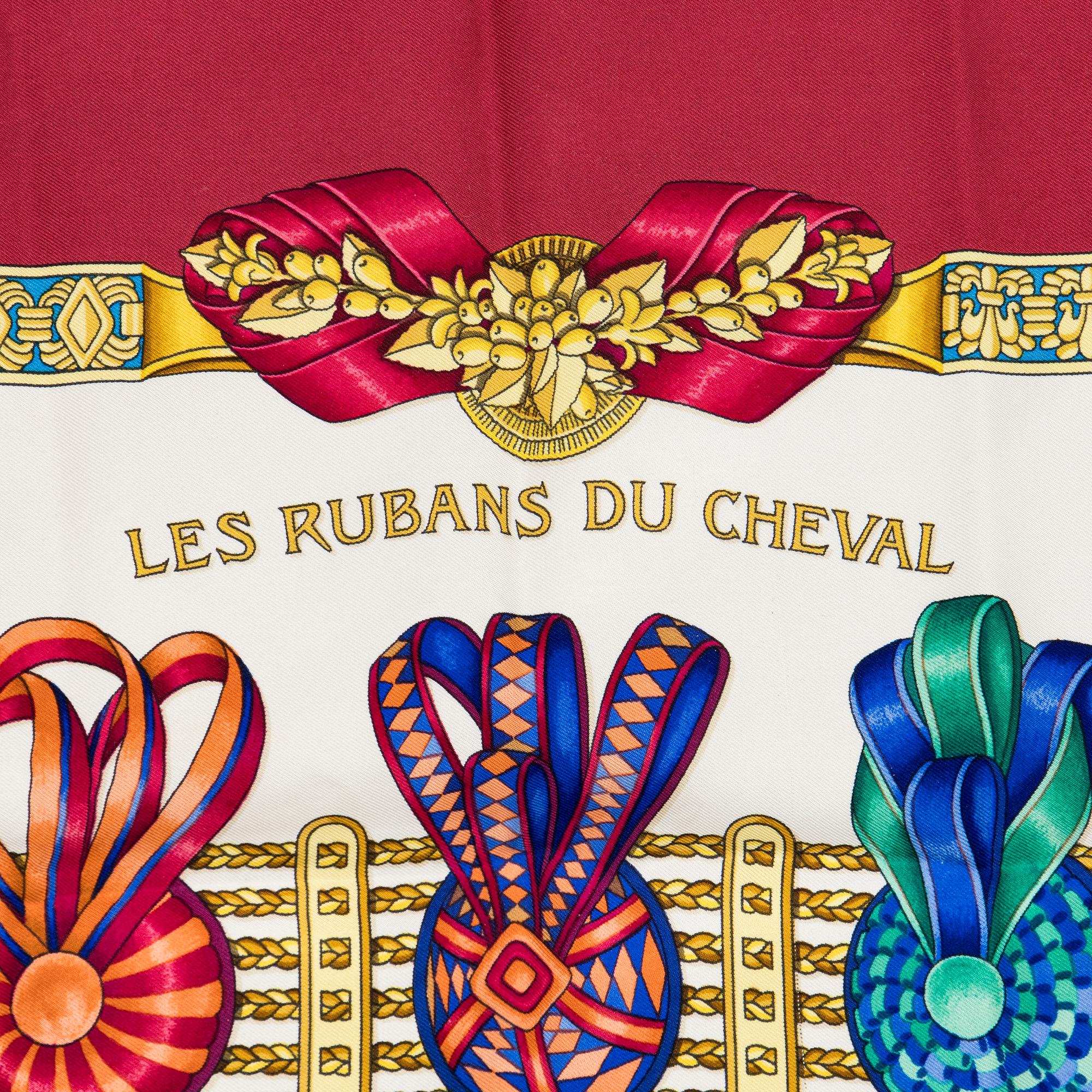 Hermès, a 'Les Rubans du Cheval' silk scarf.