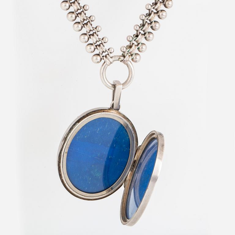 A LOCKET with partly silver and enamel.