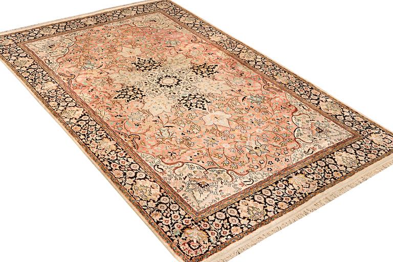 A silk Kashmar carpet, c. 280 x 177 cm.